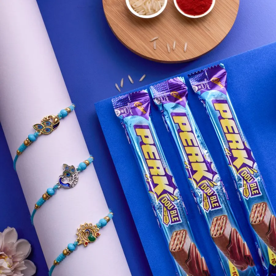 Joyful Peacock Rakhi Set With Cadbury Treats